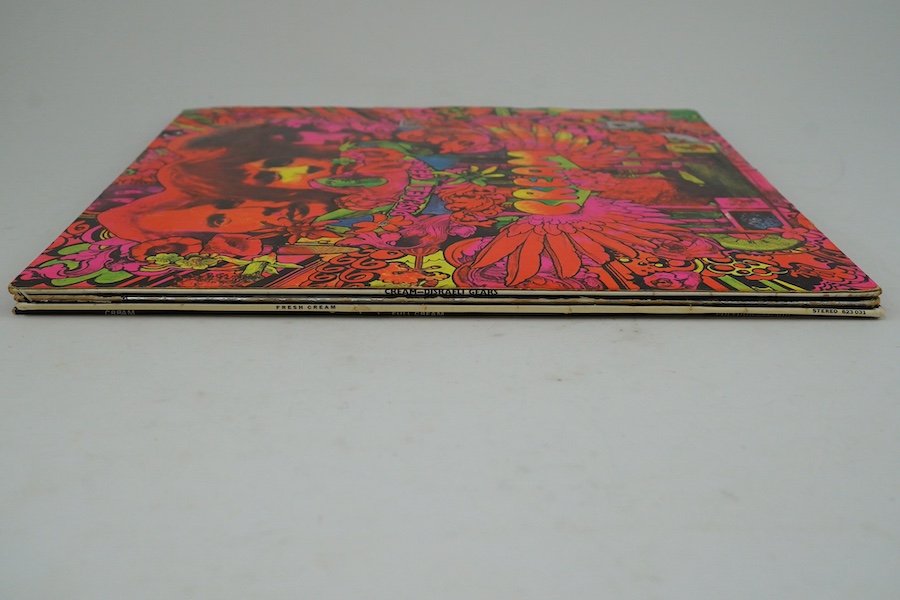 Four Cream related LP record albums; Disraeli Gears stereo on Reaction 594003, with fully laminated cover, Wheels of Fire, Fresh Cream, Full Cream. Condition - fair, minor wear to the covers and scratches to vinyl